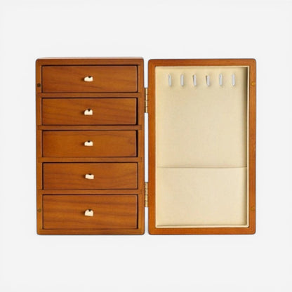 Boîte à bijoux en bois marron clair avec intérieur beige et compartiments pour bijoux.