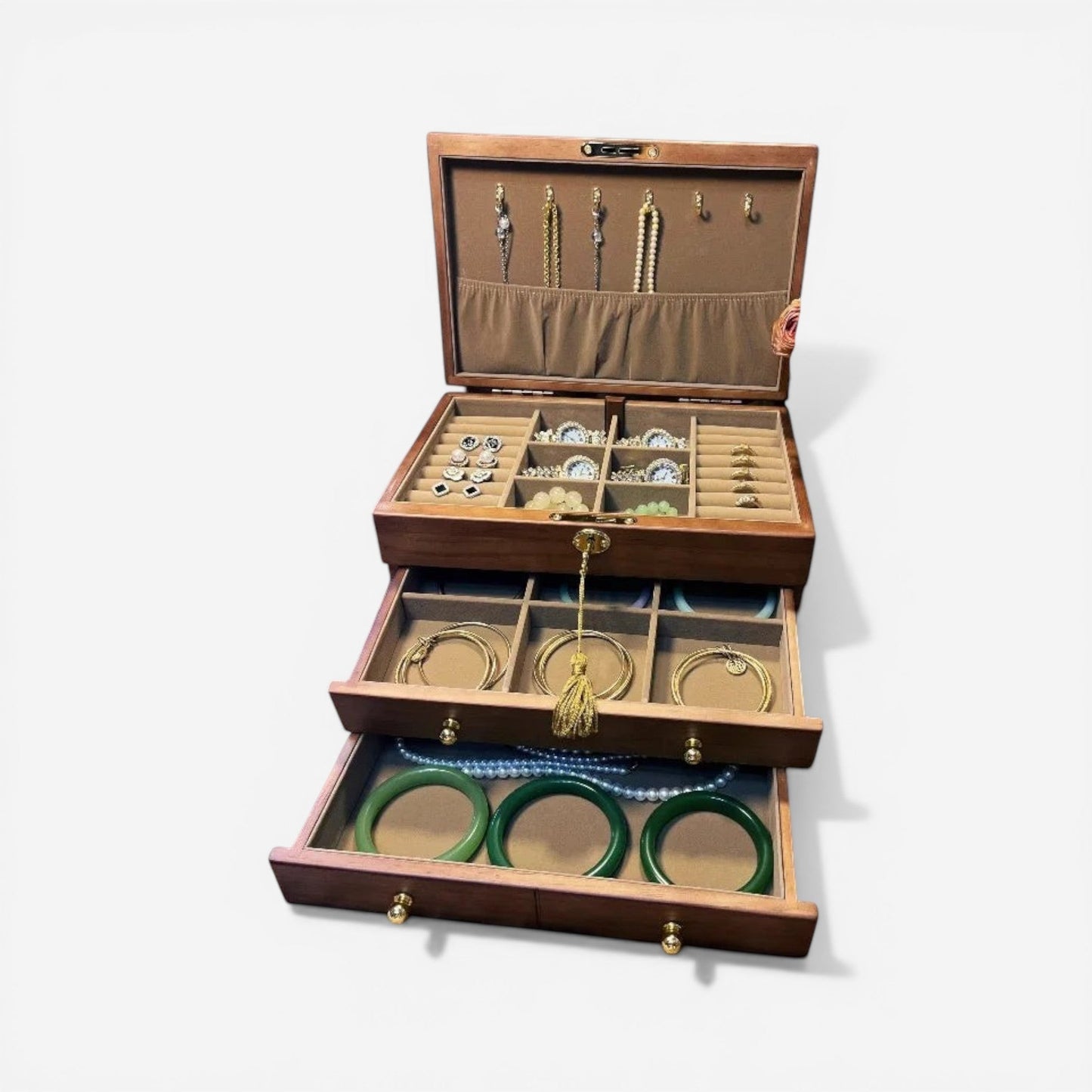 Boîte à bijoux en bois avec intérieur compartimenté, parfaite pour une organisation soignée de vos bijoux.