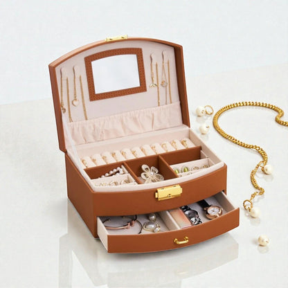 Boîte à bijoux brune avec tiroir, miroir et compartiments pour accessoires.
