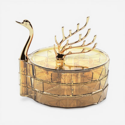 Boîte à bijoux cygne ronde dorée avec design original idéale pour organiser vos accessoires précieux.