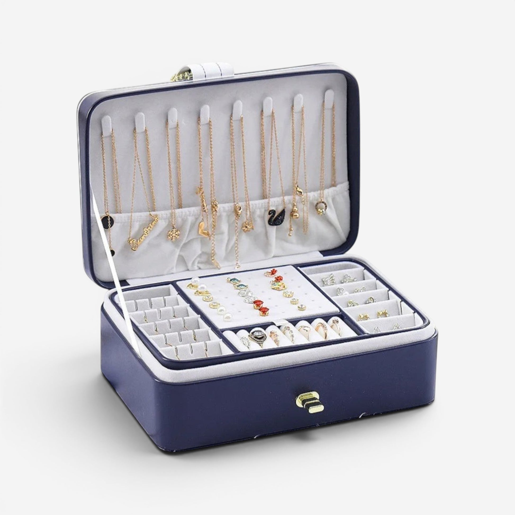 Boîte à bijoux bleue ouverte avec grande capacité de rangement, compartiments et colliers suspendus.