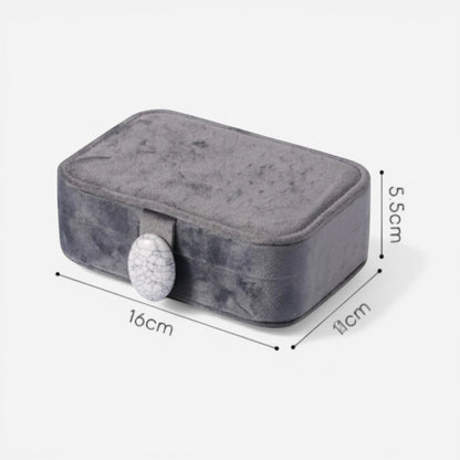 boîte à bijoux nomade grise compacte pour rangement de bijoux en déplacement