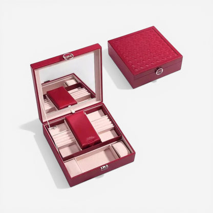 Boîte à bijoux portable rouge avec miroir pratique et élégante pour vos déplacements.