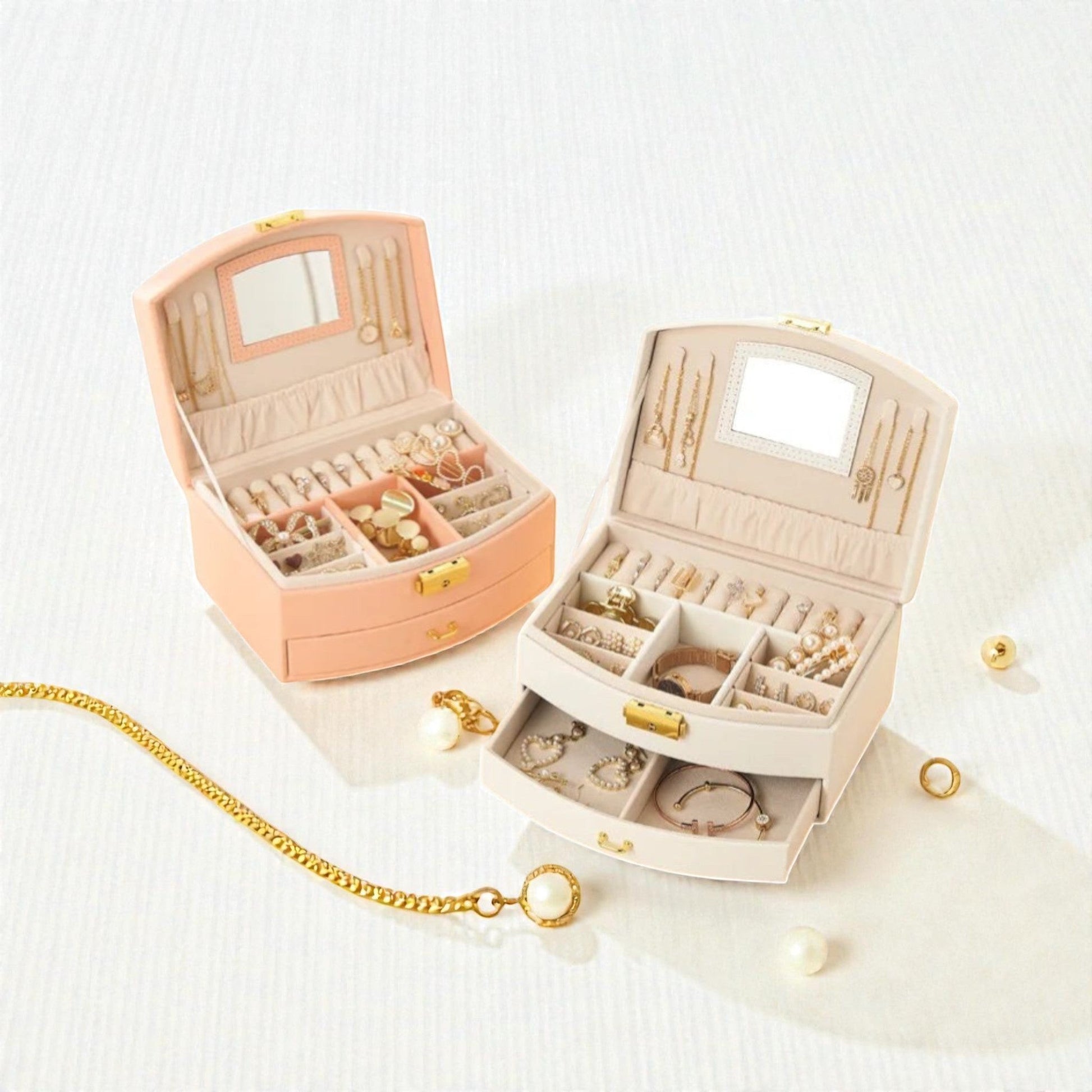 Boîtes à bijoux roses et blanches compactes avec tiroir et compartiments.