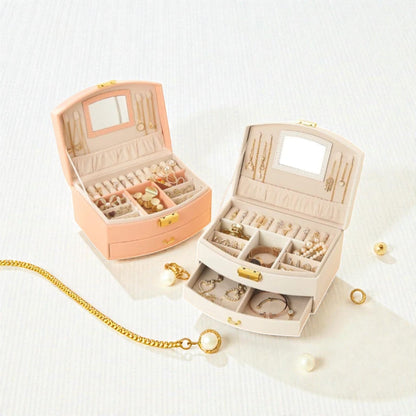 Boîtes à bijoux roses et blanches compactes avec tiroir et compartiments.