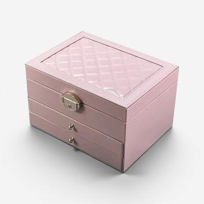 Boîte à bijoux rose avec tiroirs et couvercle matelassé pour un rangement élégant.