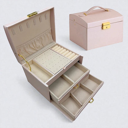 Boîte à bijoux rose élégante avec tiroirs de rangement.