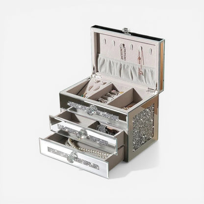 Boîte à bijoux strass avec plusieurs compartiments pour organiser bagues, colliers et accessoires.