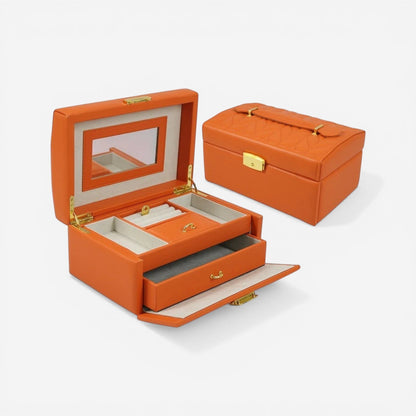 Boîte à bijoux orange avec tiroir et miroir intégré, parfaite pour organiser vos accessoires avec élégance.