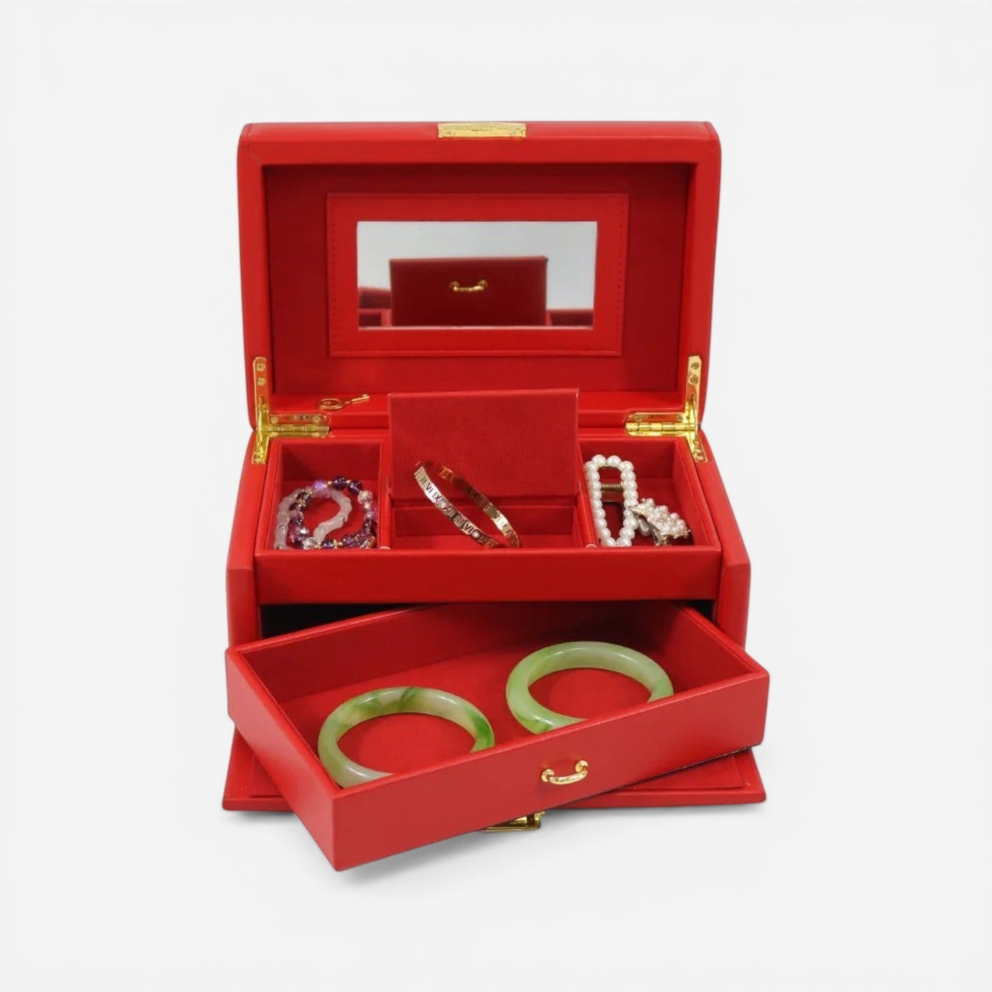 Boîte à bijoux rouge avec tiroir, idéale pour un rangement élégant des bagues, colliers et bracelets.