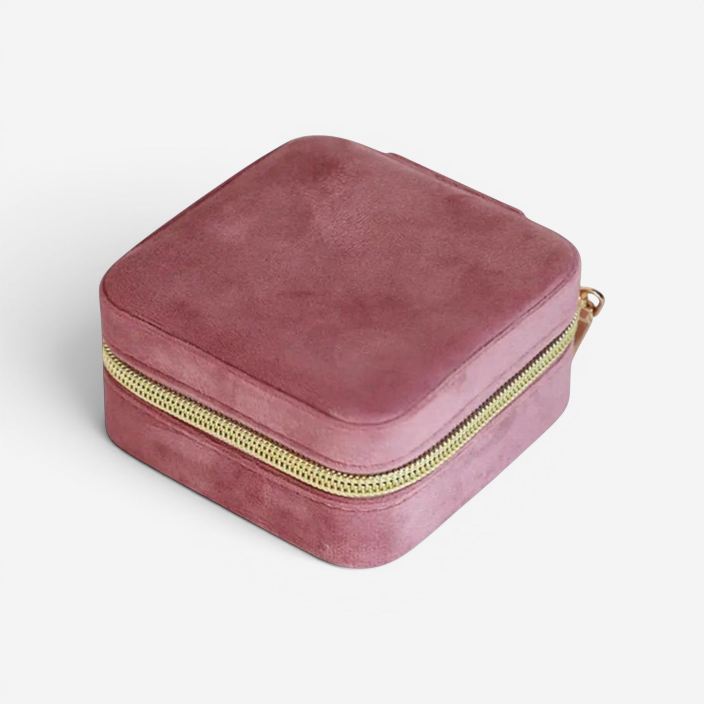Boîte à bijoux en velours rose foncé, fermée avec fermeture éclair et design compact.
