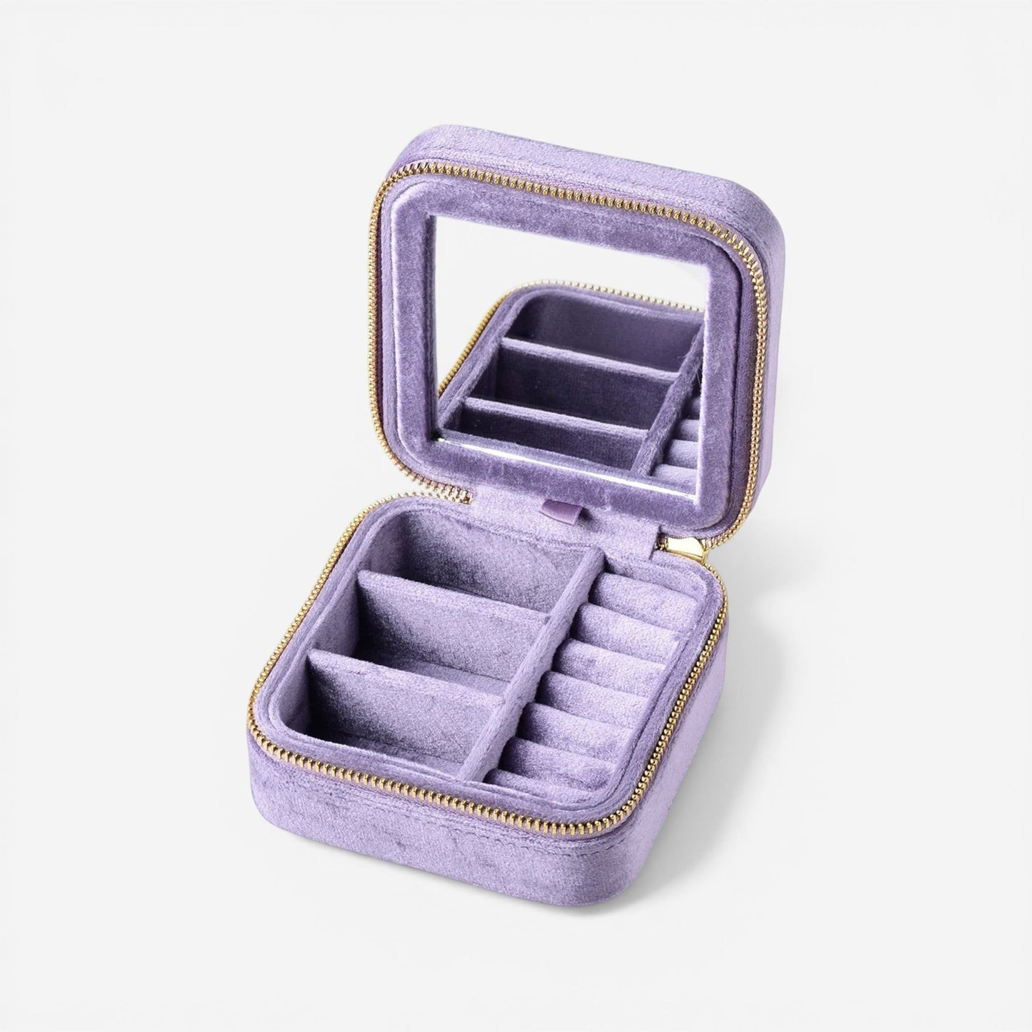 Boîte à bijoux de voyage en velours rose avec compartiments pratiques pour organiser vos accessoires avec style.