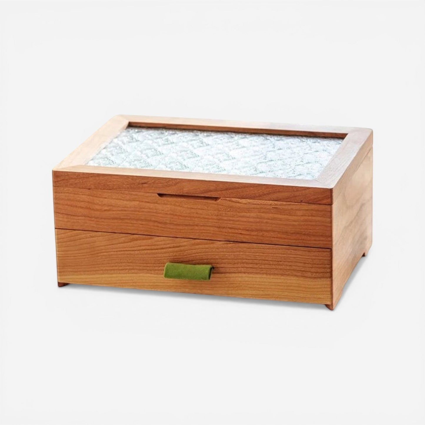 Boîte à bijoux en velours vert compacte et élégante, idéale pour un rangement discret et raffiné.