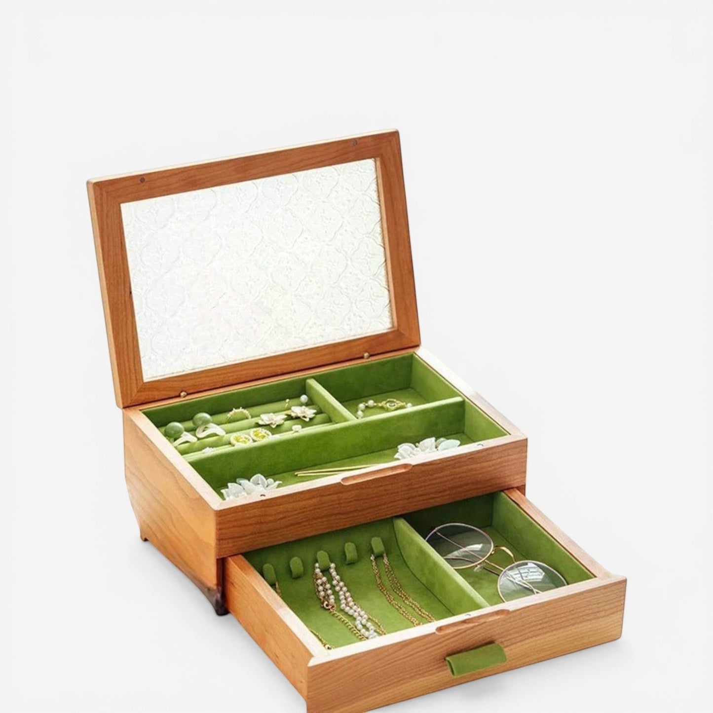 Boîte à bijoux en velours vert élégante avec compartiments pour ranger bagues, colliers et accessoires avec soin.