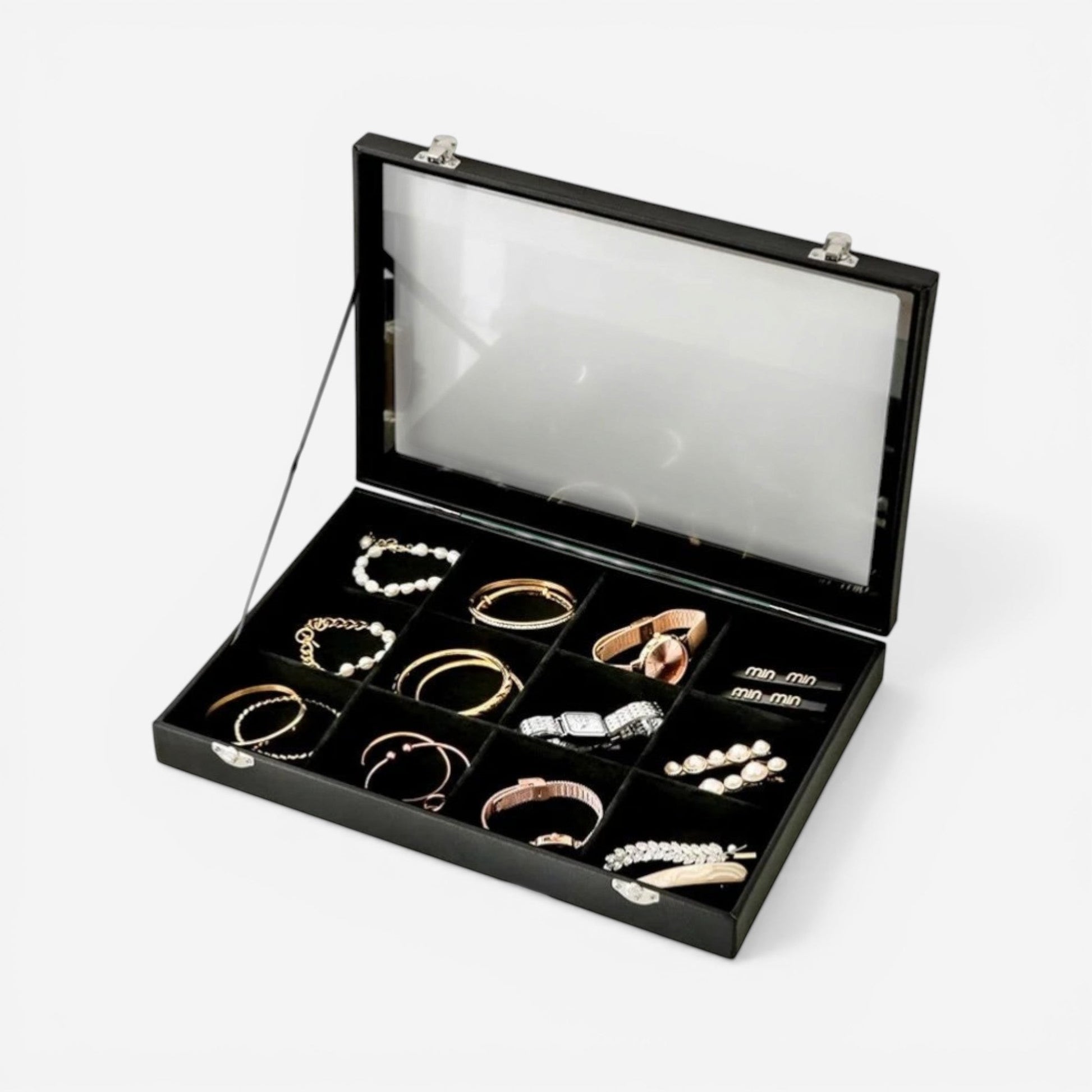 Boîte à bijoux compacte en cuir noir avec vitre transparente, pour un rangement élégant des bijoux.