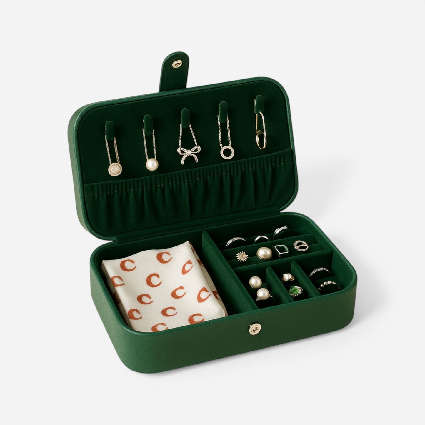 Boîte à bijoux portable en cuir PU vert avec intérieur compartimenté pour bagues, boucles d’oreilles et colliers.