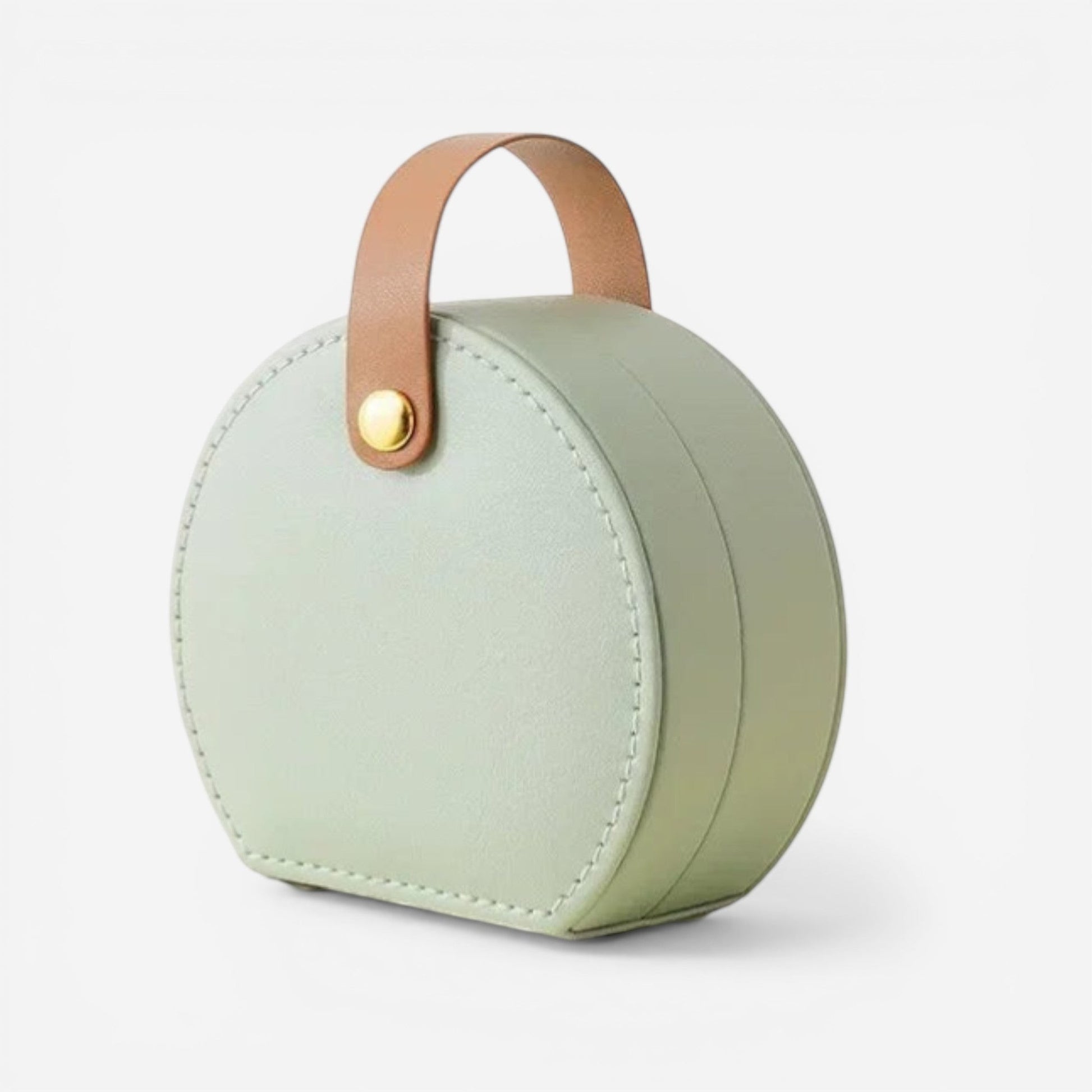 Boîte à bijoux de voyage ronde en vert sauge avec poignée, pratique pour transporter les bijoux.