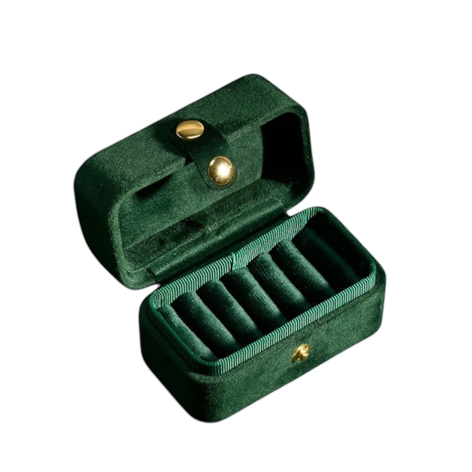 Boîte à bijoux de voyage en velours vert foncé, avec compartiments pour organiser les bijoux.