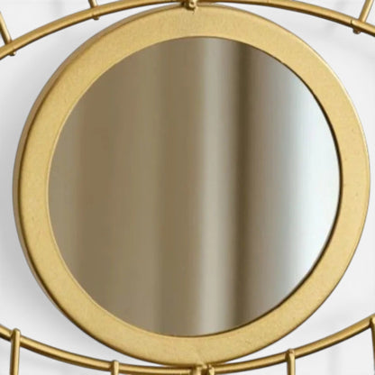 miroir rond avec structure dorée intégré à un présentoir à bijoux élégant