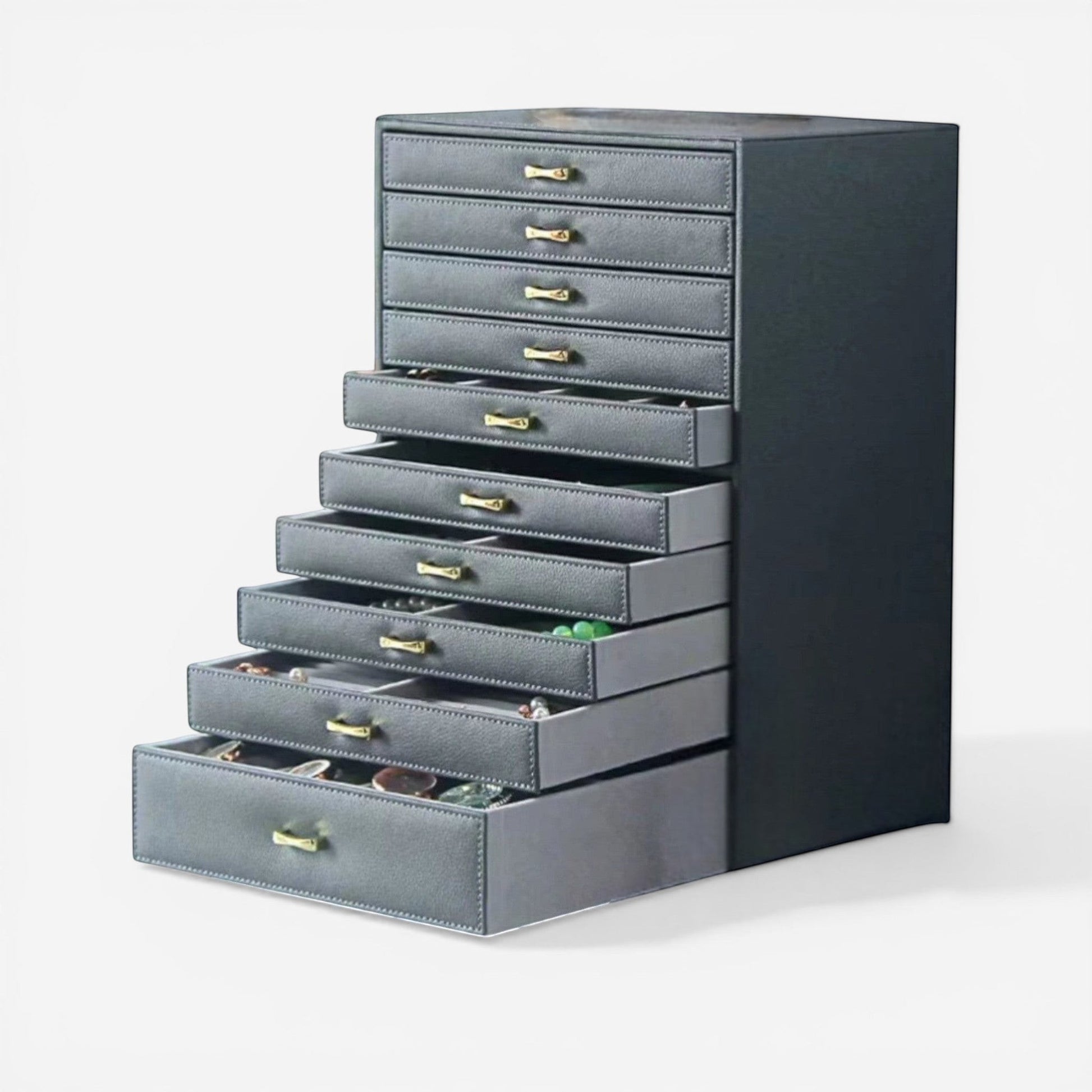 Organisateur de bijoux gris avec plusieurs tiroirs pour ranger bagues, colliers et accessoires.