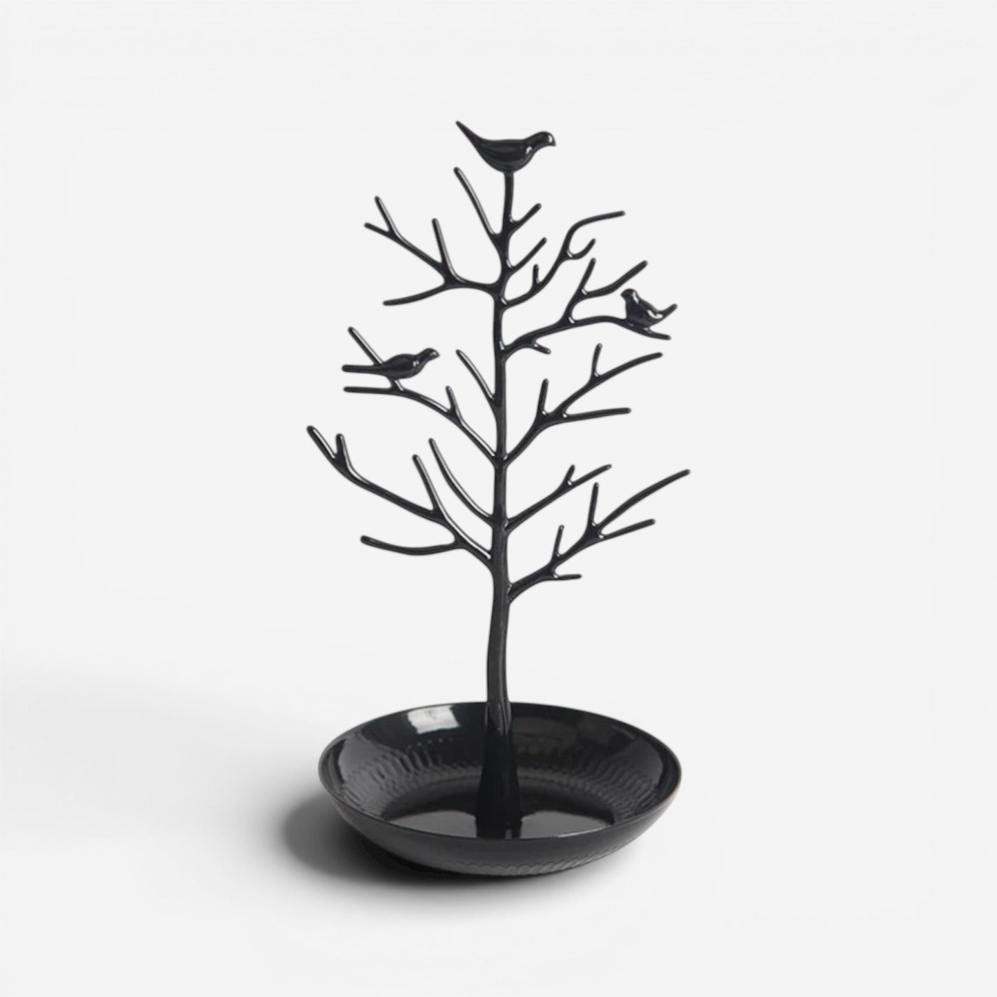 Présentoir à bijoux en alliage noir au design minimaliste, en forme d’arbre pour suspendre les bijoux.