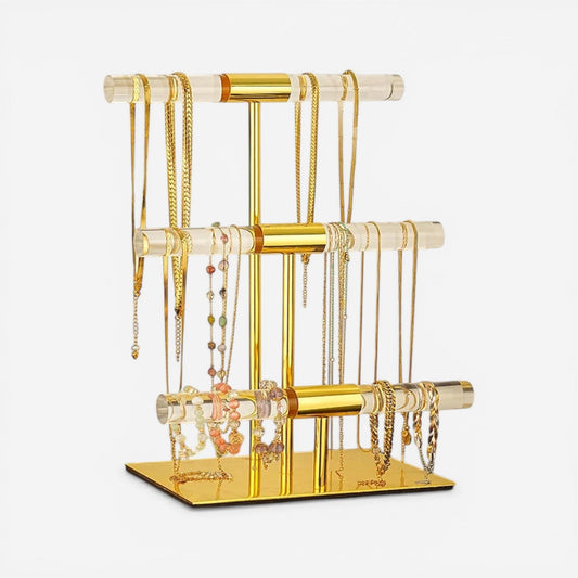 présentoir à bijoux de luxe doré avec plusieurs niveaux pour organiser colliers, bracelets et bagues