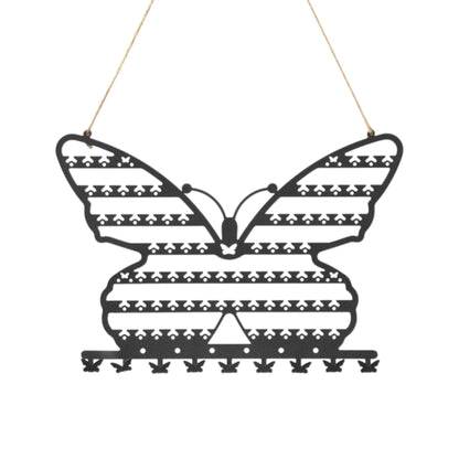 Présentoir à bijoux mural en forme de papillon noir avec rangées pour suspendre les accessoires.