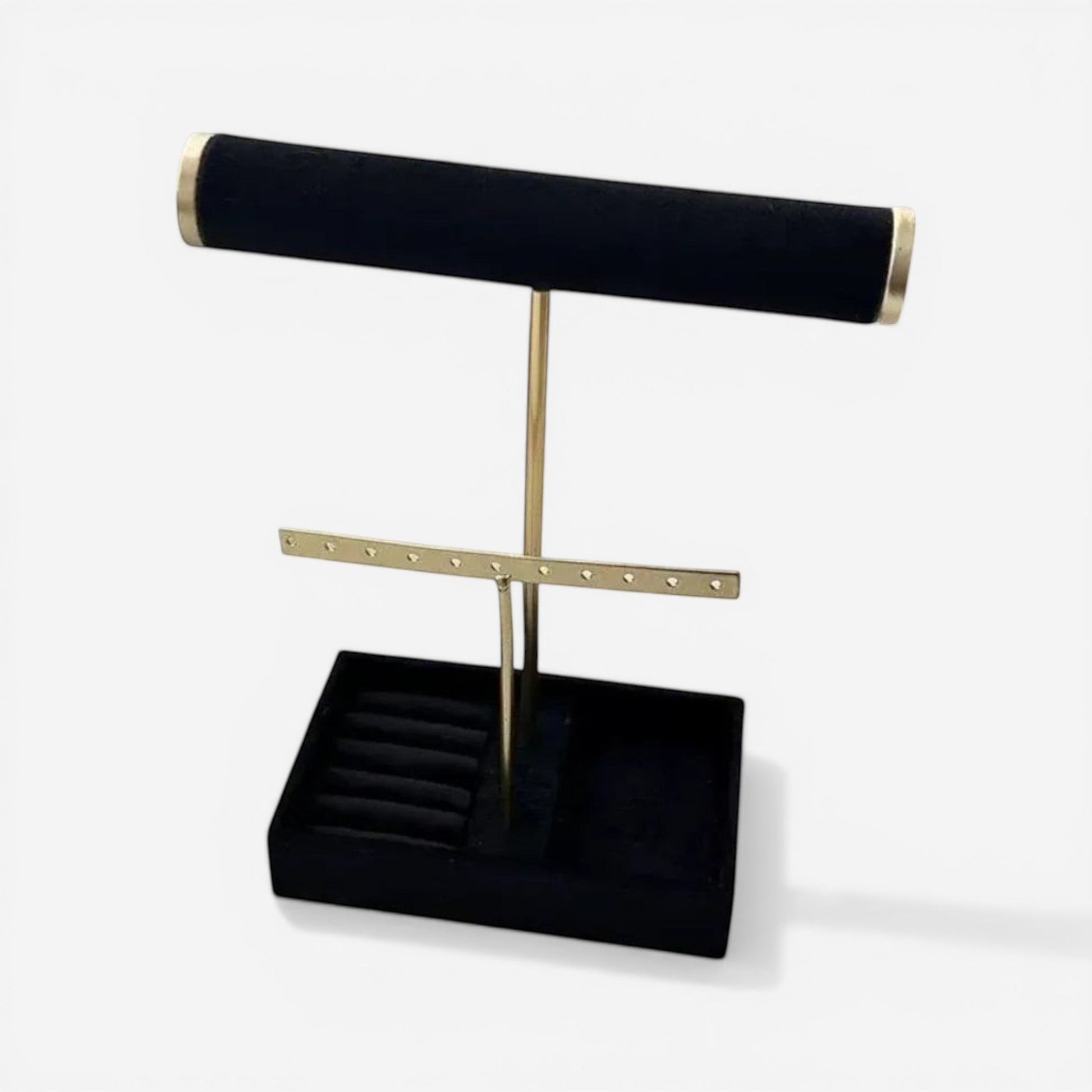 Présentoir à bijoux en velours noir avec barre minimaliste, idéal pour exposer colliers et bracelets avec élégance.