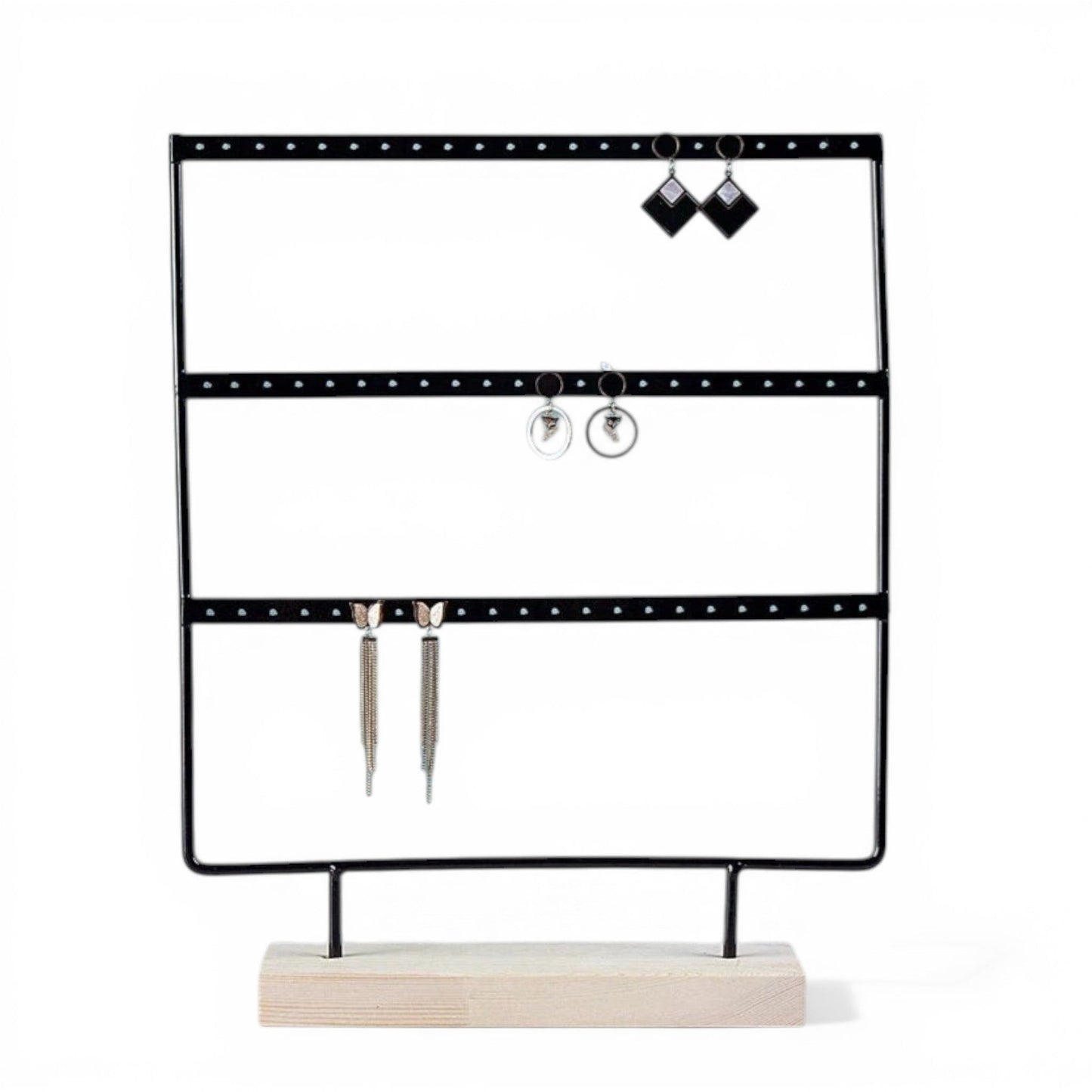 Présentoir à boucles d’oreilles noir avec plusieurs rangées pour organiser les bijoux.